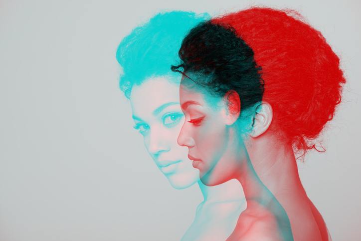 A double-exposure portrait split into teal and red, representing two ways of seeing the world