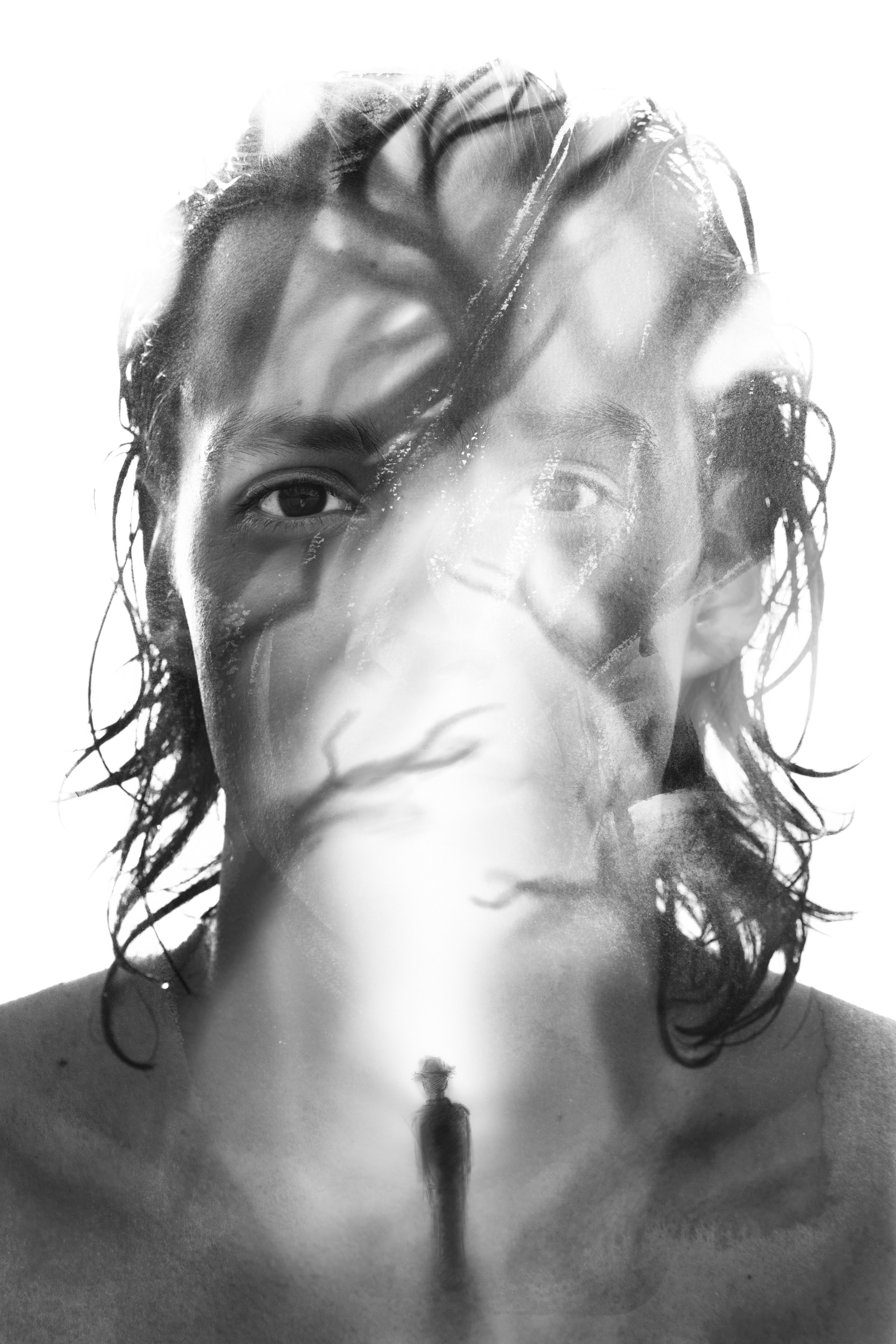 A double-exposure portrait of a face and a lone figure, evoking nightmares