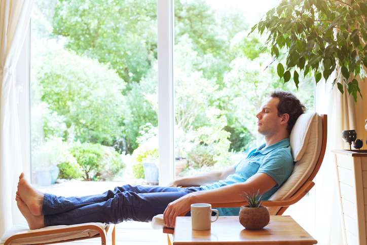 A person calm and at ease at home